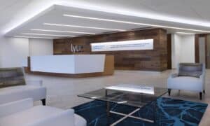 Real wood flooring finds new life on the wall behind the reception desk